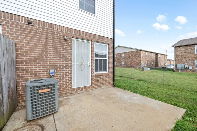 a view of a backyard with plants and garden
