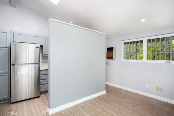 a kitchen with stainless steel appliances granite countertop a sink stove a microwave and cabinets