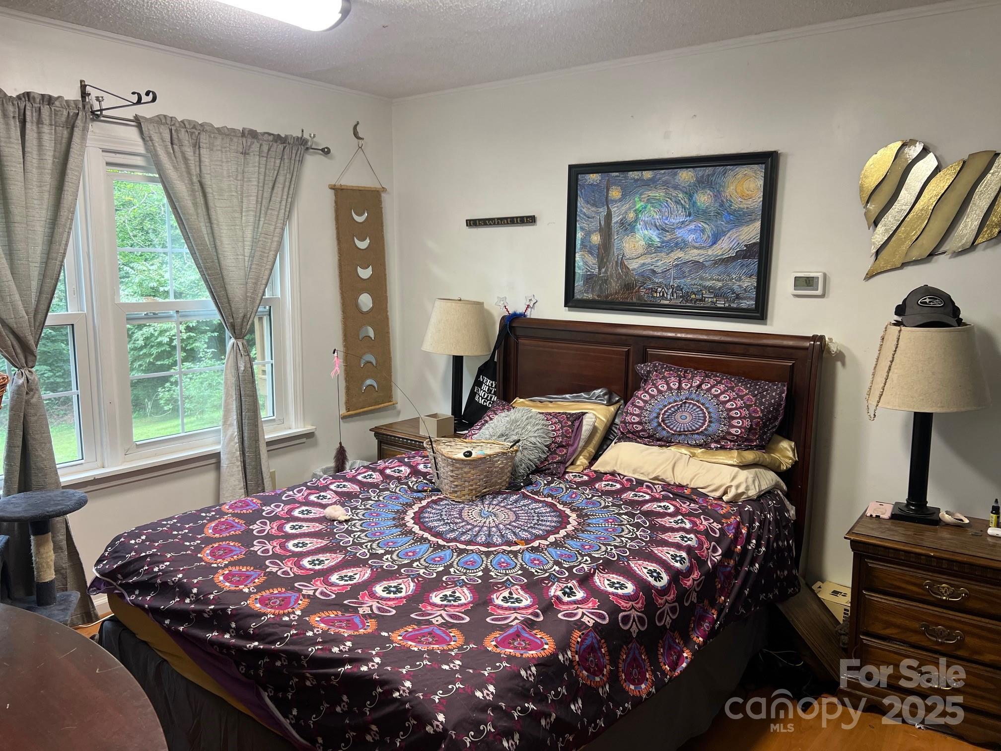 404 Patton Street Morganton, NC 28655 - Photo 11 of 40 a bedroom with a bed and a window