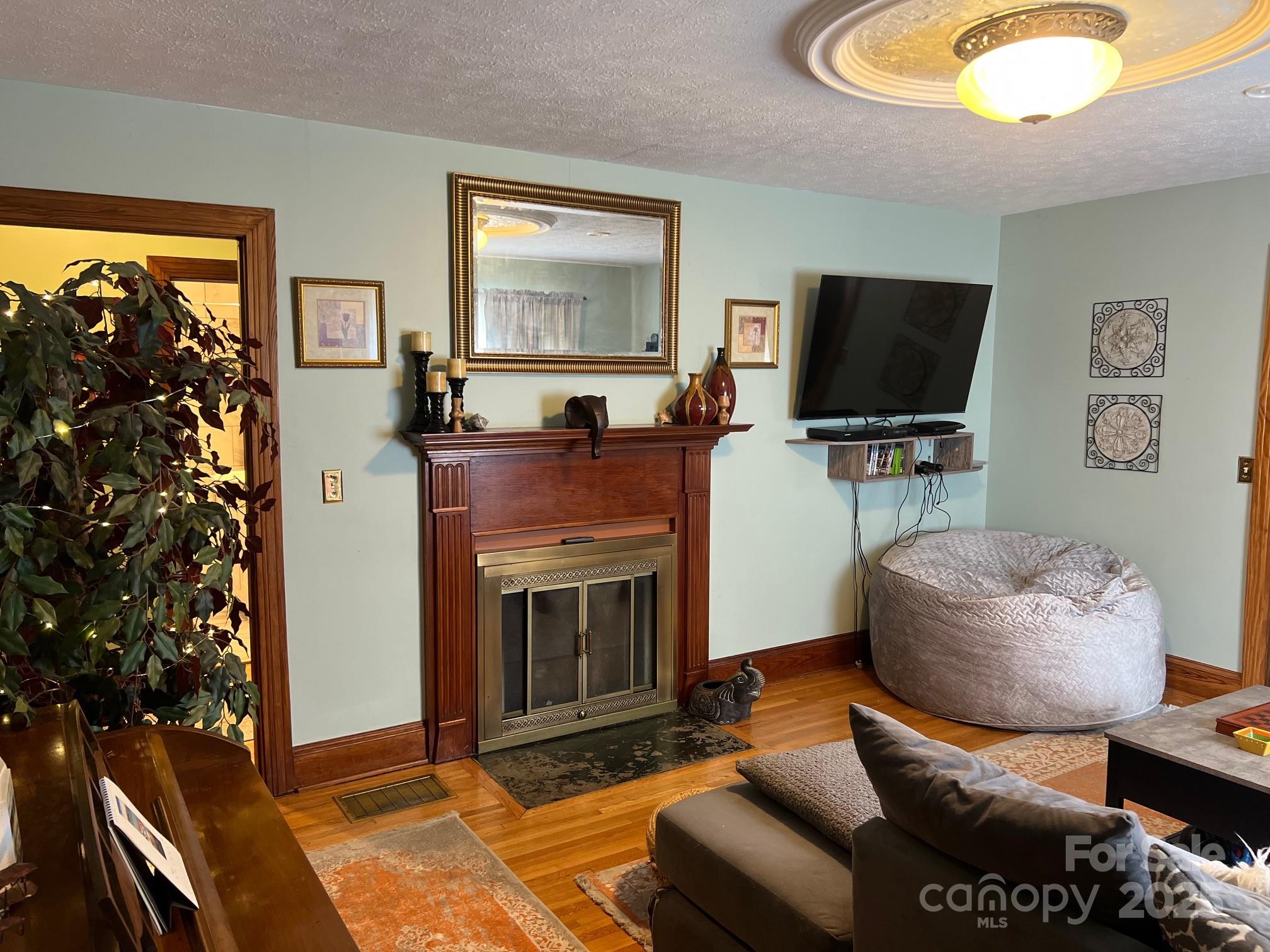 404 Patton Street Morganton, NC 28655 - Photo 18 of 40 a living room with furniture and a flat screen tv