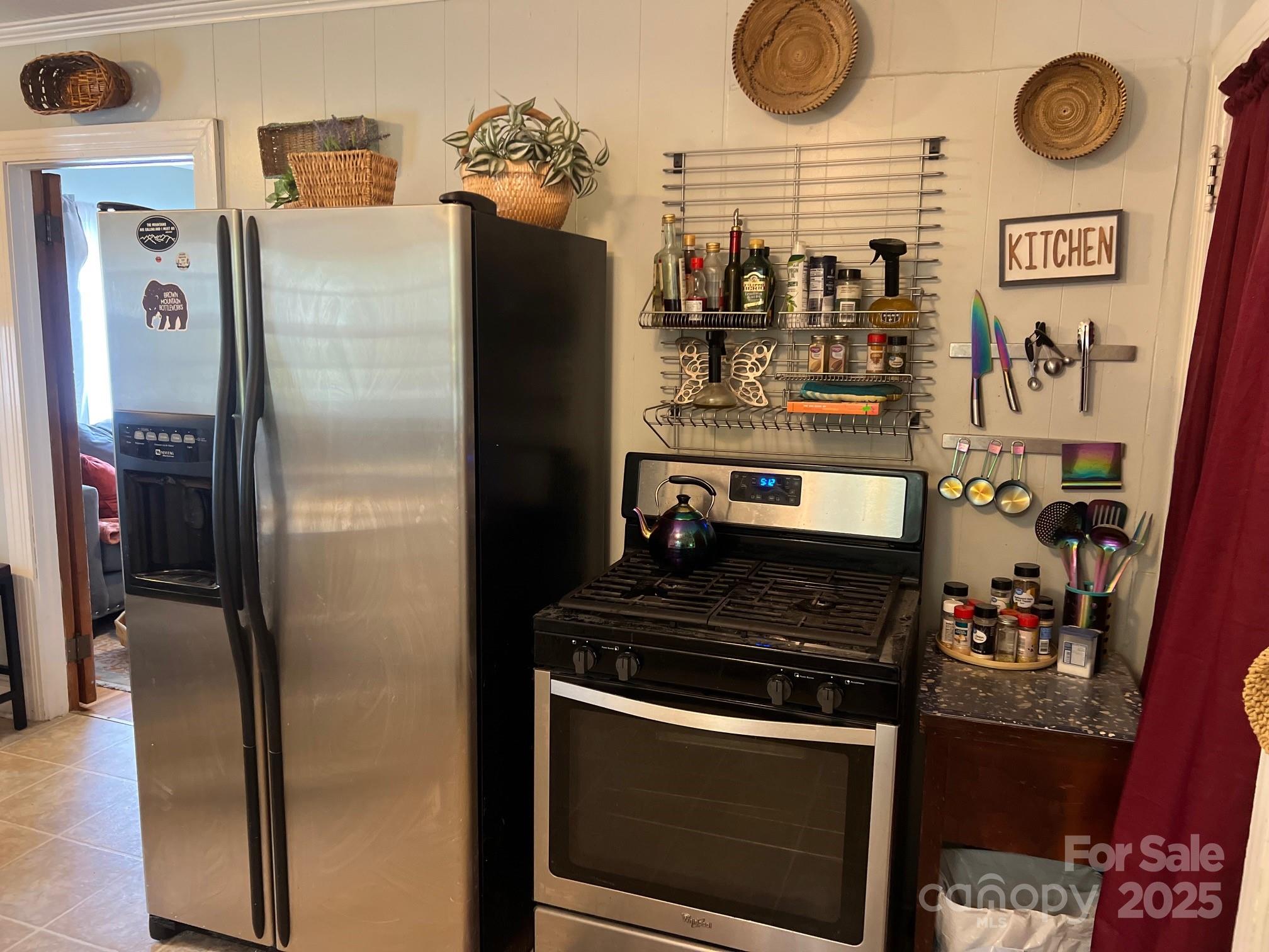 404 Patton Street Morganton, NC 28655 - Photo 19 of 40 a kitchen with stainless steel appliances granite countertop a stove and a refrigerator
