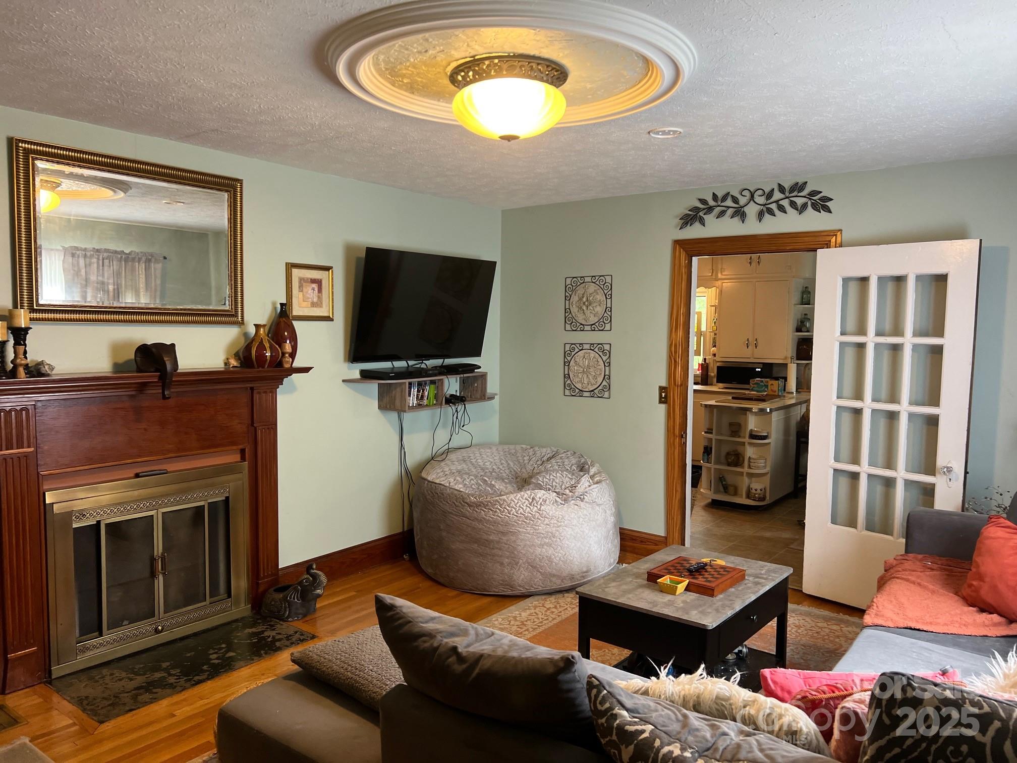 404 Patton Street Morganton, NC 28655 - Photo 23 of 40 a living room with furniture and a flat screen tv