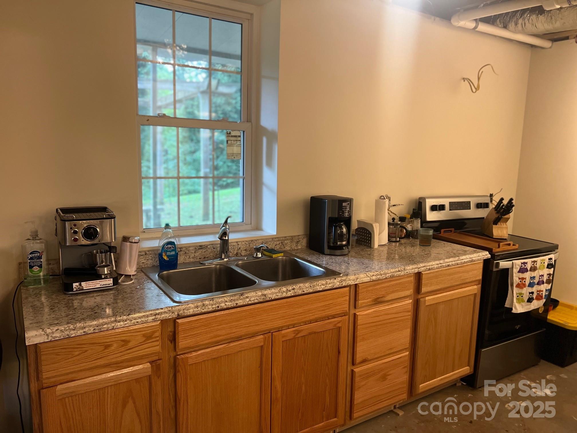 404 Patton Street Morganton, NC 28655 - Photo 26 of 40 a kitchen with a sink and cabinets