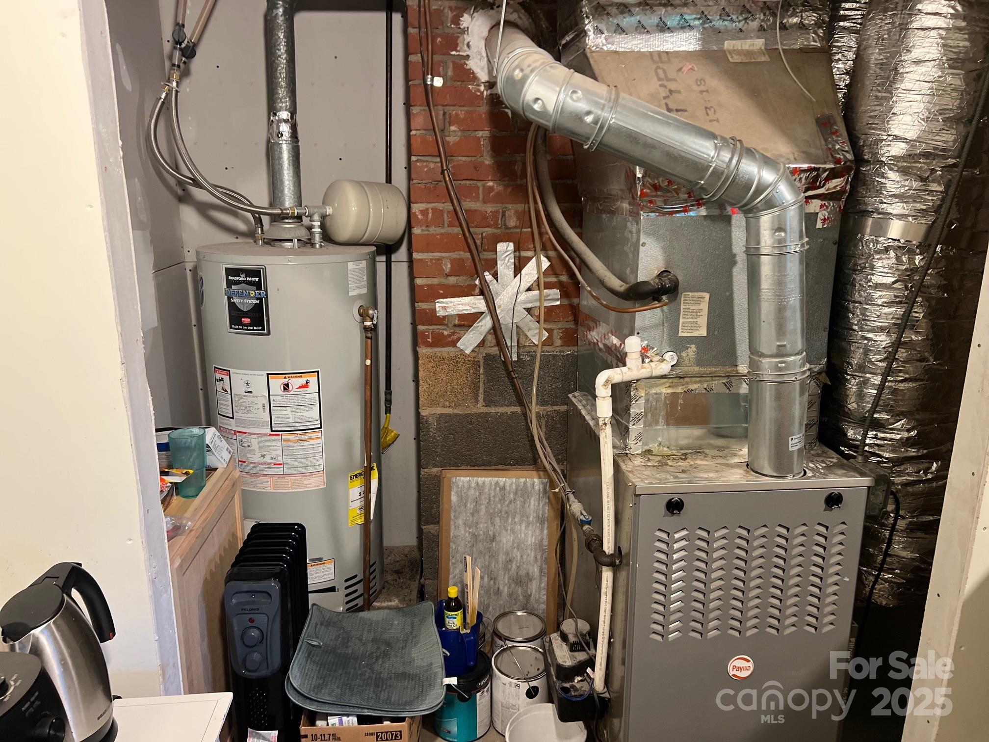 404 Patton Street Morganton, NC 28655 - Photo 27 of 40 a picture of water heater room