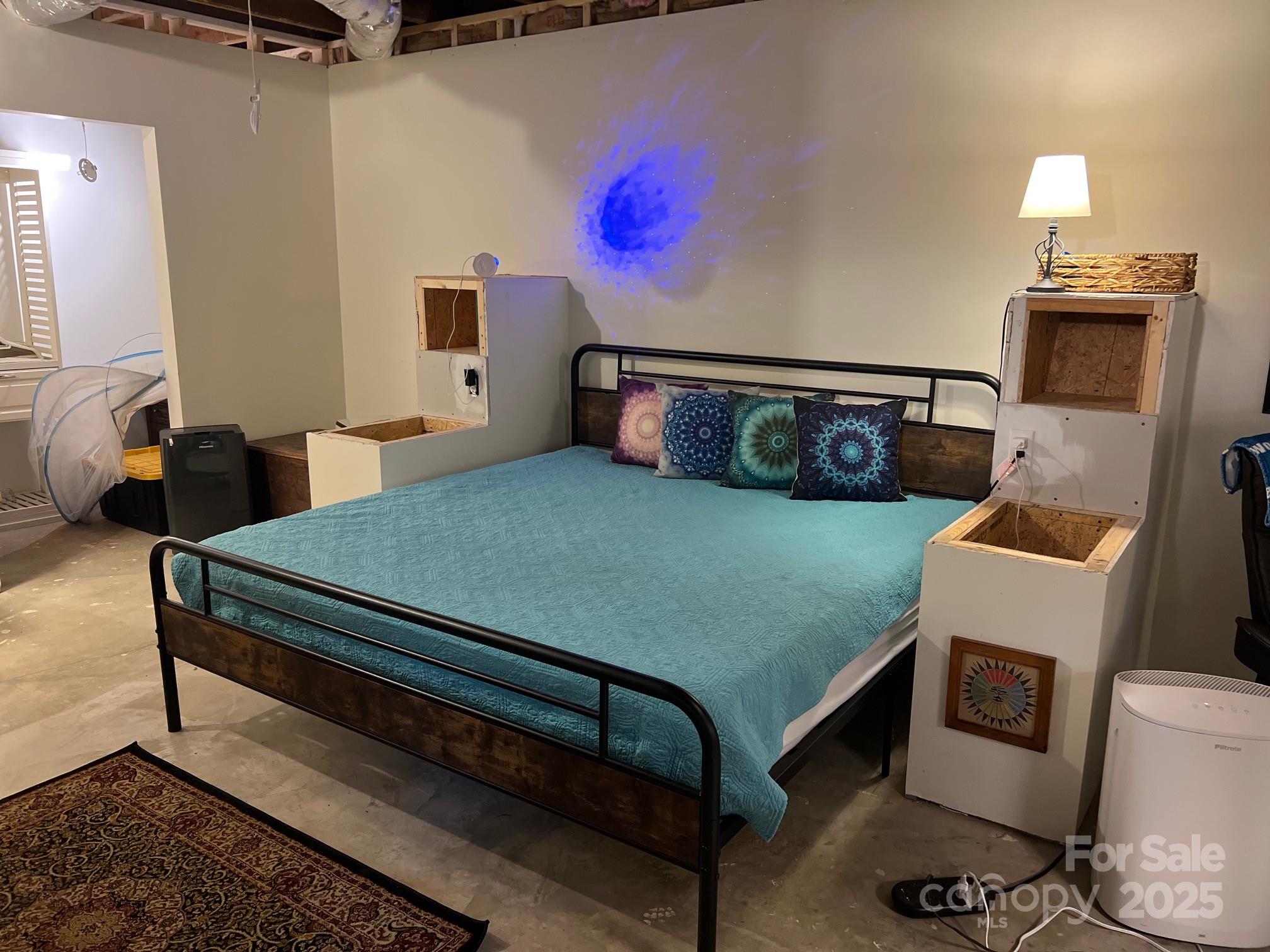 404 Patton Street Morganton, NC 28655 - Photo 29 of 40 a bedroom with a bed and wooden floor