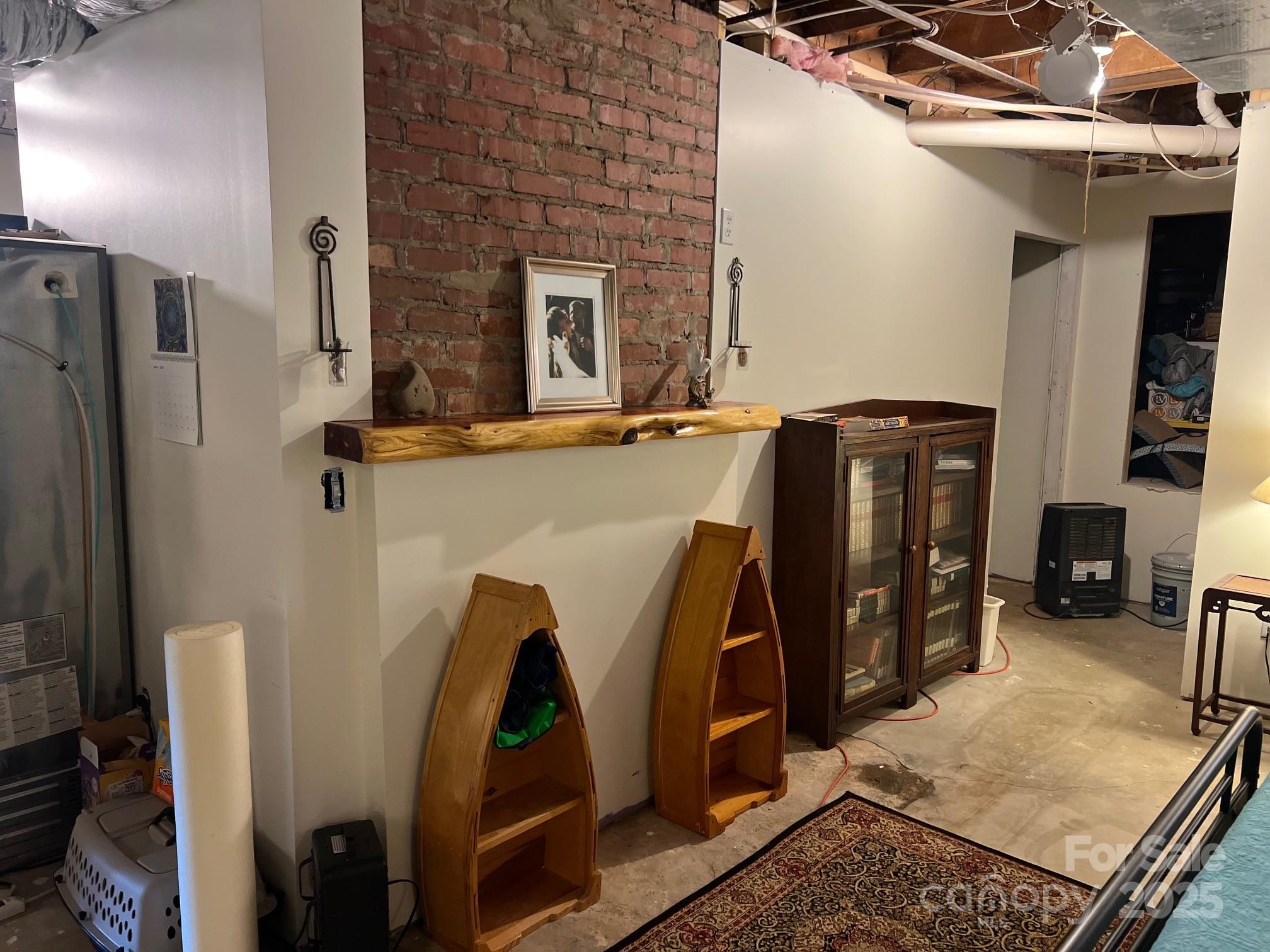 404 Patton Street Morganton, NC 28655 - Photo 30 of 40 a view of walk in closet with clothes and shoes