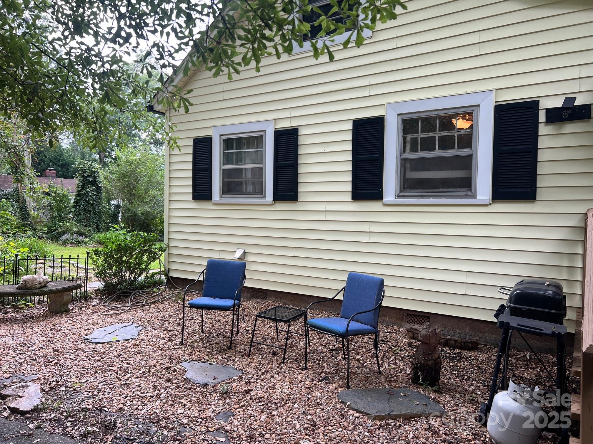 404 Patton Street Morganton, NC 28655 - Photo 3 of 40 a wooden bench sitting in front of a house