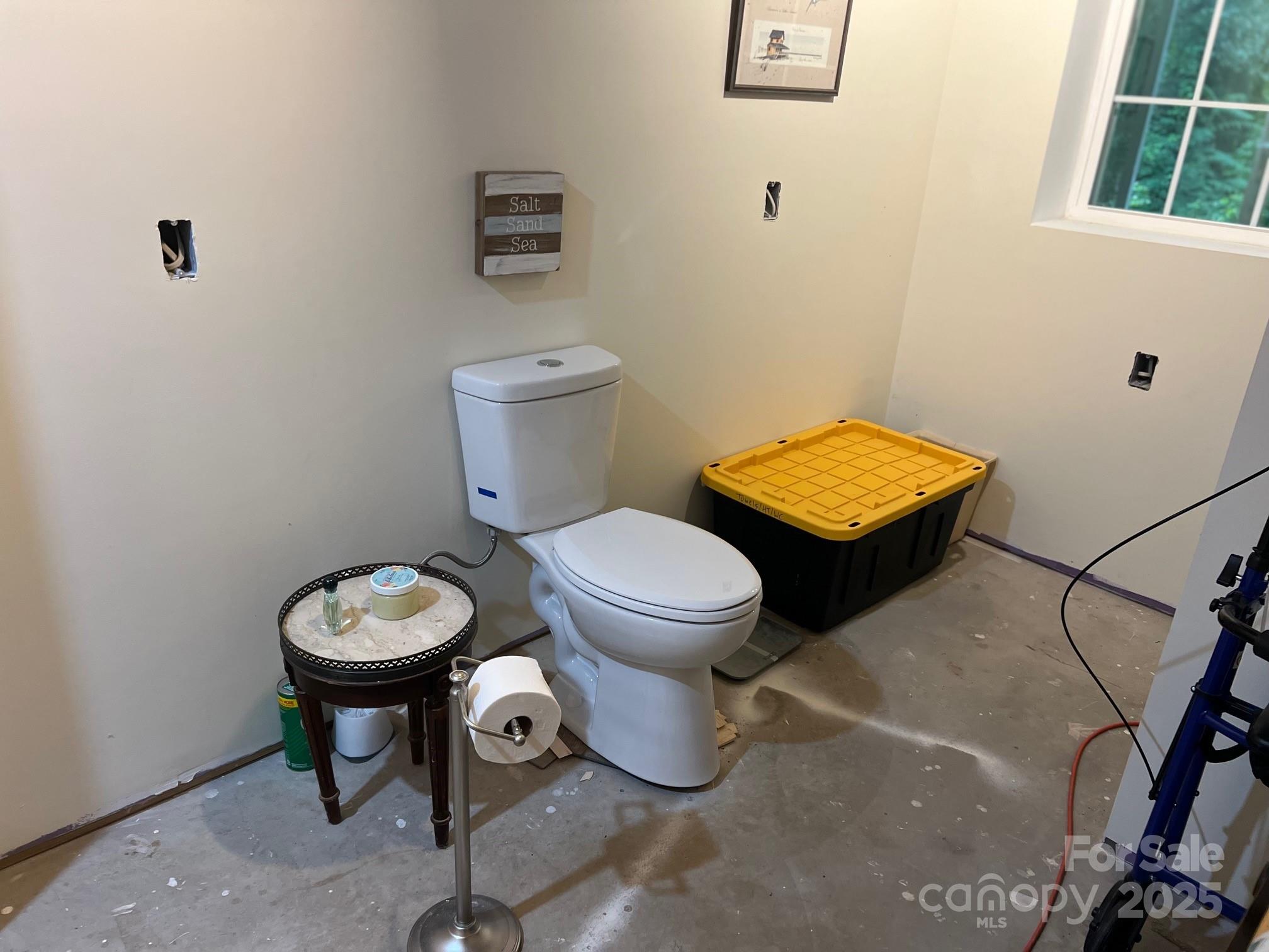 404 Patton Street Morganton, NC 28655 - Photo 32 of 40 a bathroom with a toilet and a sink