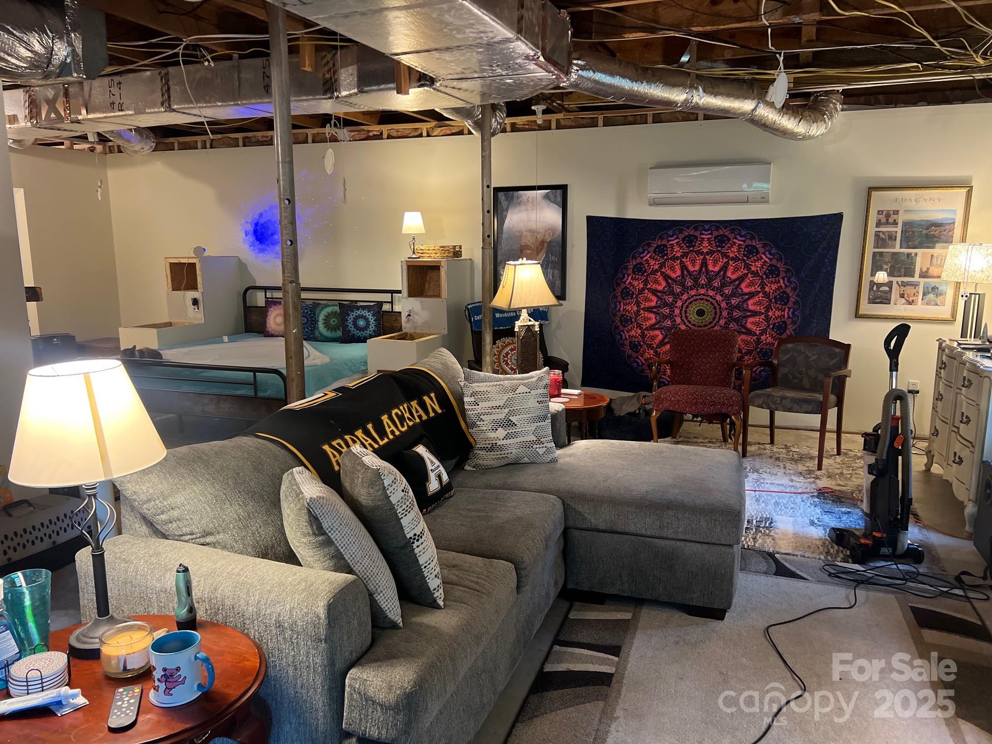 404 Patton Street Morganton, NC 28655 - Photo 34 of 40 a bed room with furniture and a fireplace