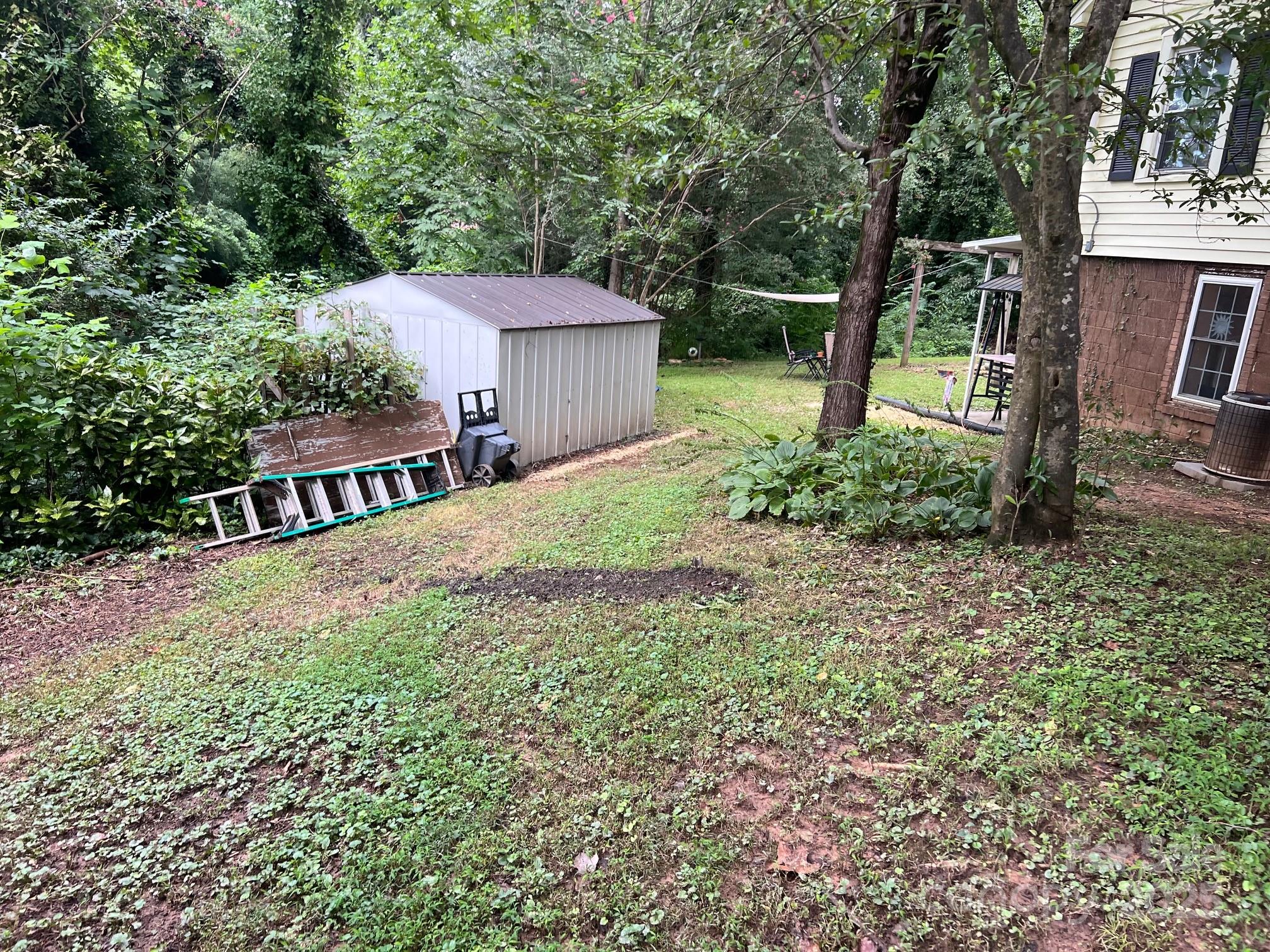 404 Patton Street Morganton, NC 28655 - Photo 40 of 40 a view of a house with backyard and a tree