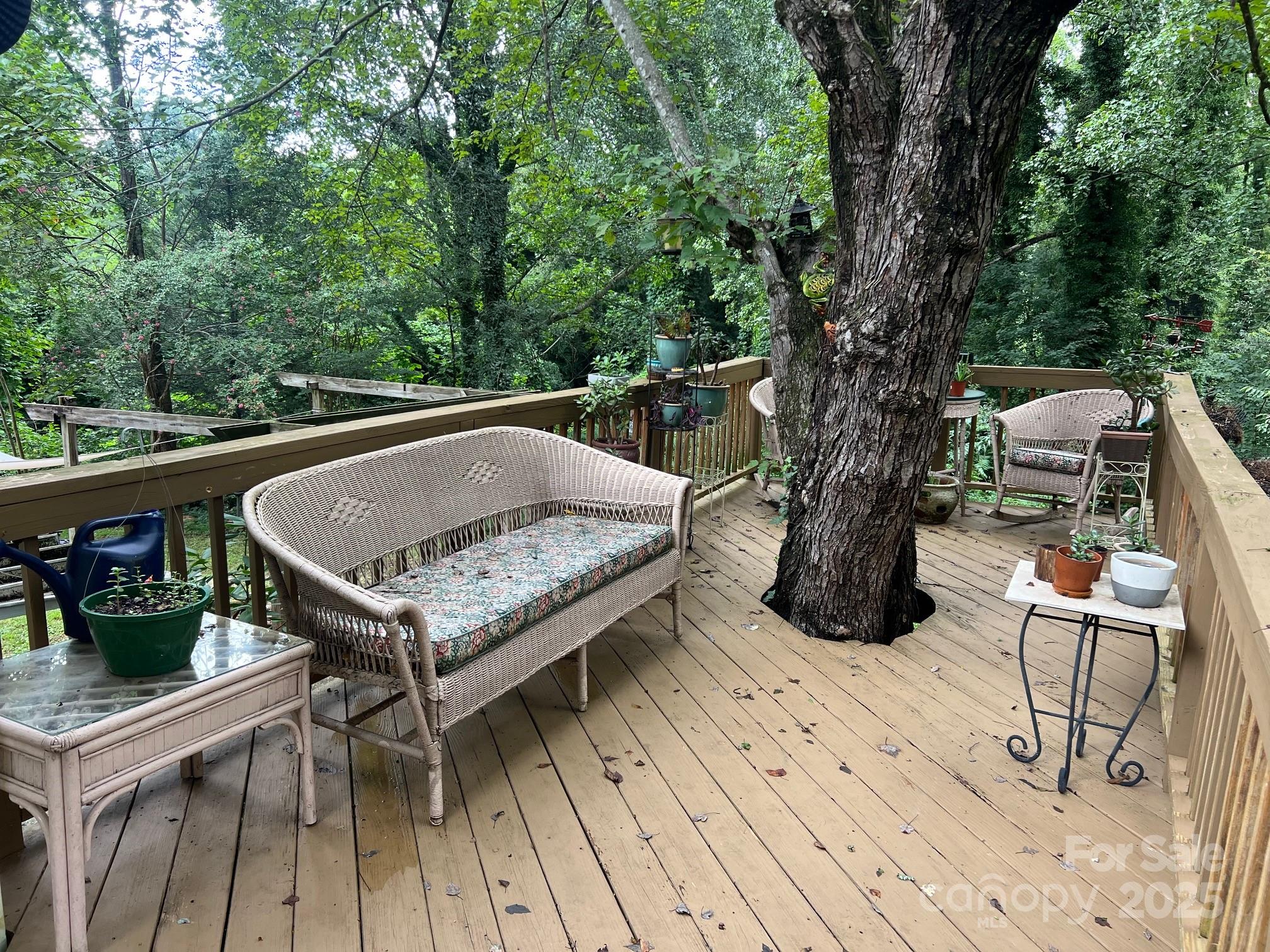 404 Patton Street Morganton, NC 28655 - Photo 4 of 40 a view of balcony with wooden floor and outdoor seating