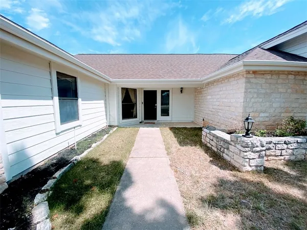 a front view of a house with a rug