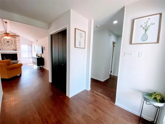 a view of a livingroom with furniture and wooden floor