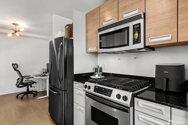 a kitchen with a stove and a microwave