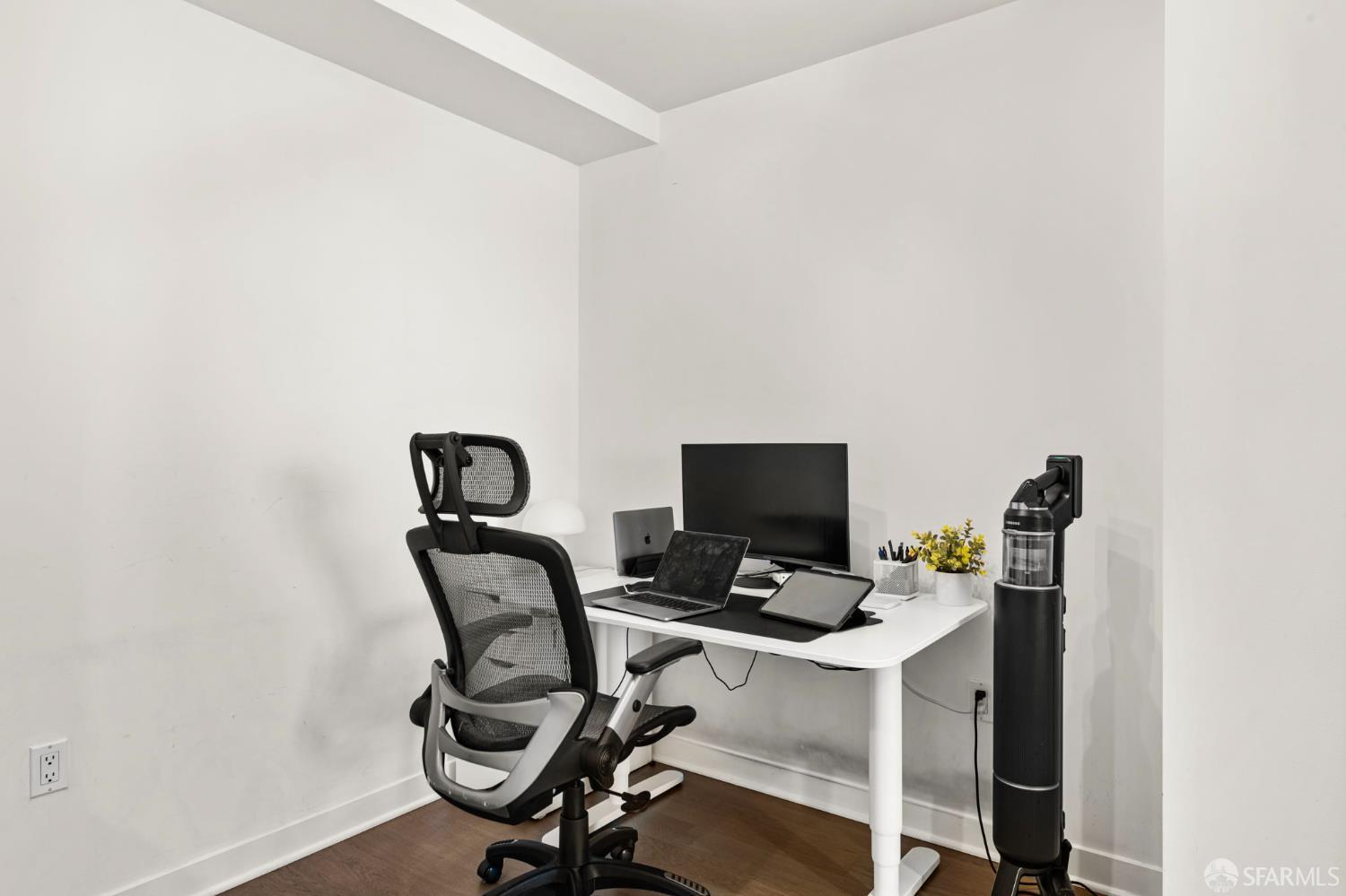 300 Berry Street, Unit 721 San Francisco, CA 94158 - Photo 14 of 27 a view of a workspace with furniture and wooden floor