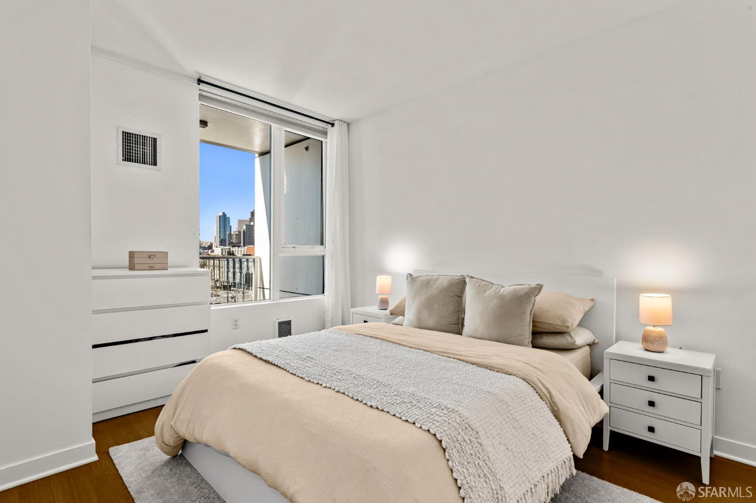 300 Berry Street, Unit 721 San Francisco, CA 94158 - Photo 15 of 27 a bedroom with a bed and a cabinets