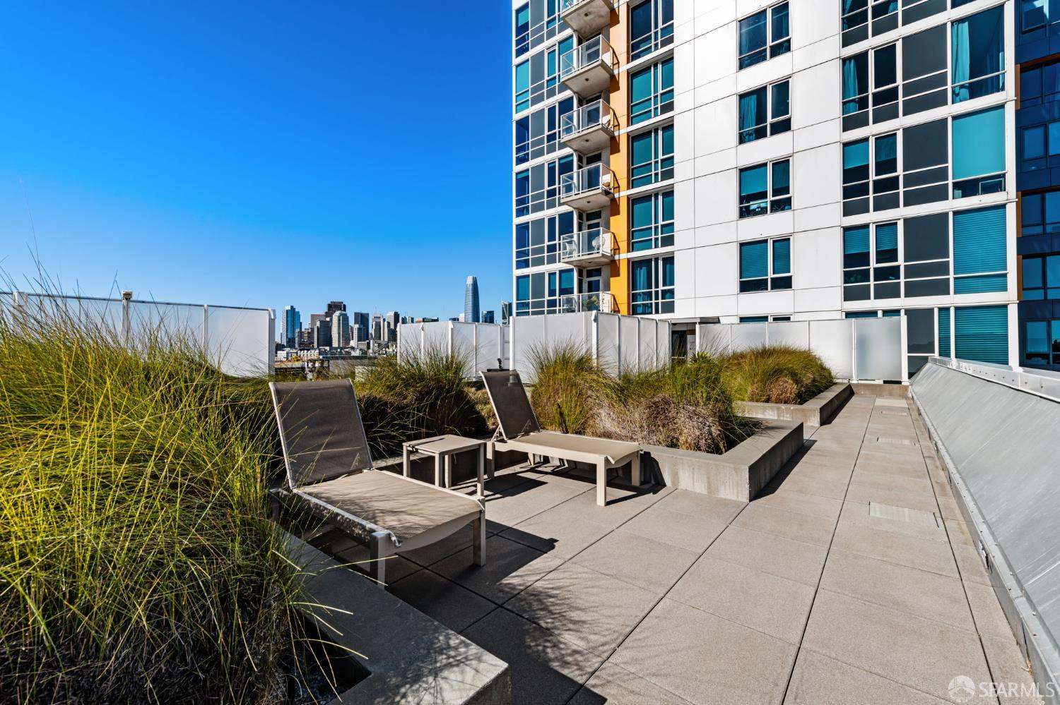 300 Berry Street, Unit 721 San Francisco, CA 94158 - Photo 26 of 27 a view of a patio with couches and potted plants