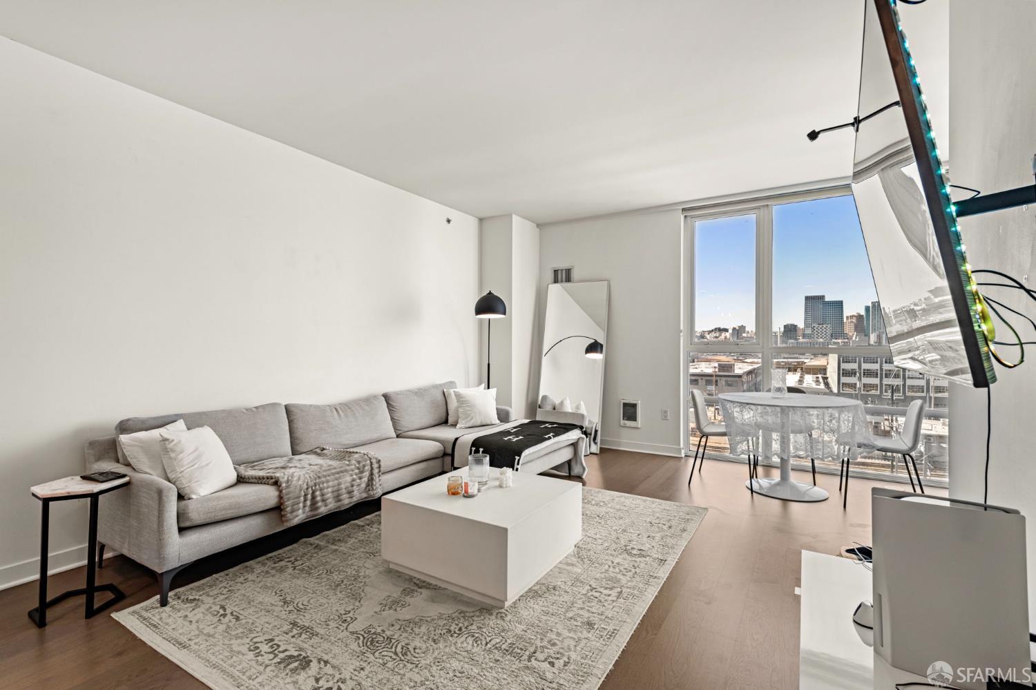 300 Berry Street, Unit 721 San Francisco, CA 94158 - Photo 7 of 27 a living room with furniture and a table