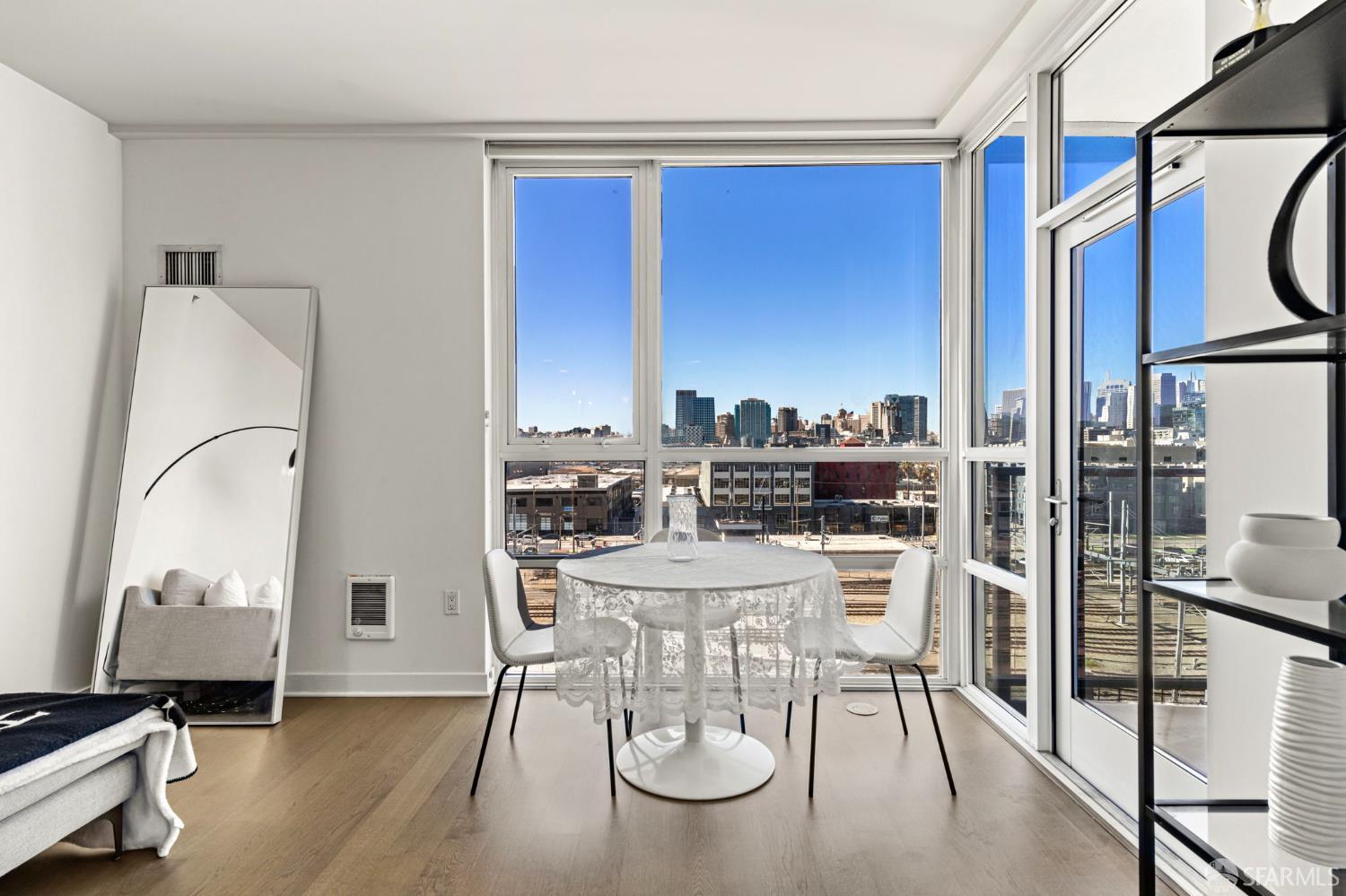 300 Berry Street, Unit 721 San Francisco, CA 94158 - Photo 9 of 27 a view of a dining room with furniture and a window