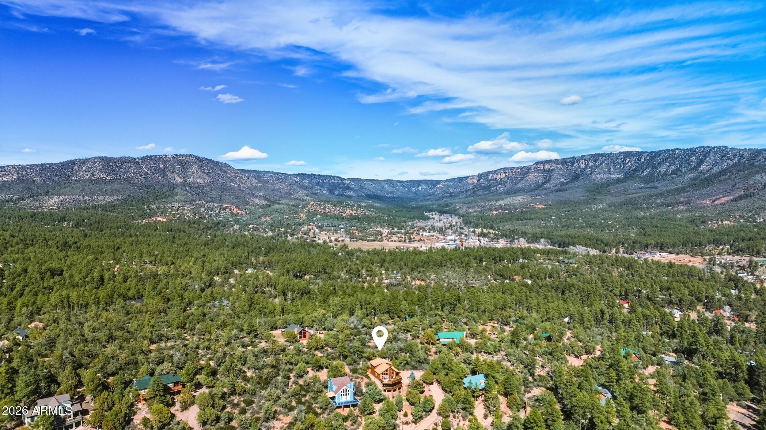 3119 Kysar Way Pine, AZ 85544 - Photo 55 of 68 a view of a lush green forest with mountains in the background
