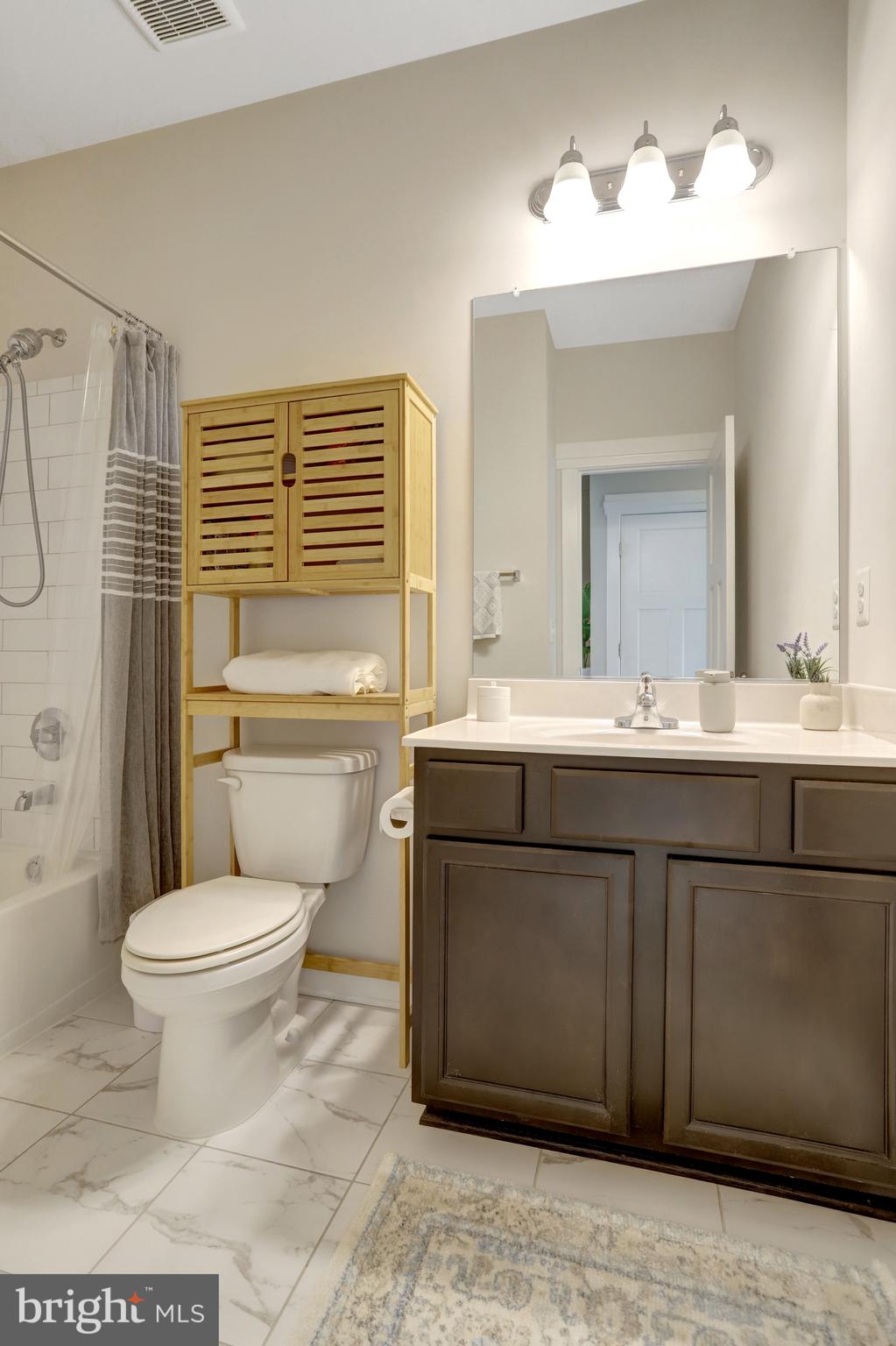 9180 Snowden Ashford Road Lorton, VA 22079 - Photo 19 of 28 a bathroom with a sink toilet and shower