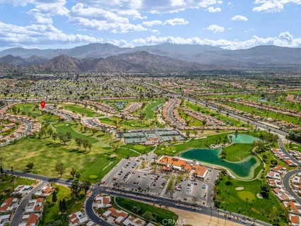 a view of a house with garden and yard