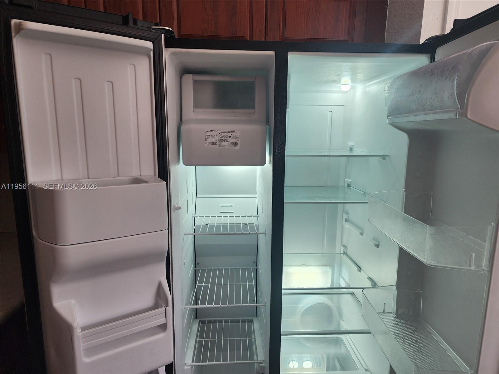 6970 Northwest 177th Street, Unit M103 Hialeah, FL 33015 - Photo 23 of 38 a bathroom with a shower and closet