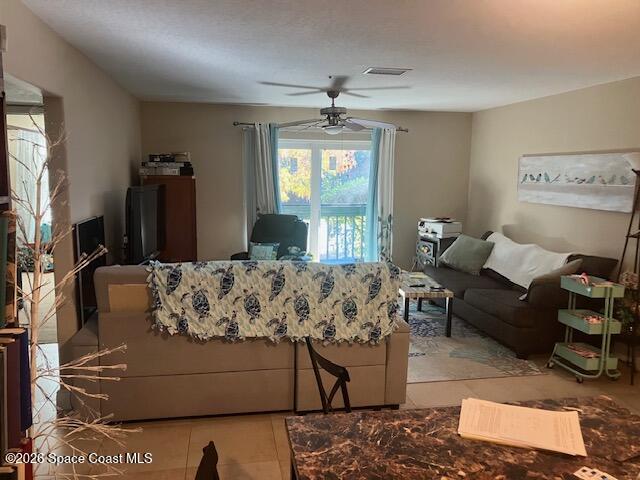 7667 North Wickham Road, Unit 102 Melbourne, FL 32940 - Photo 15 of 15 a living room with furniture and window