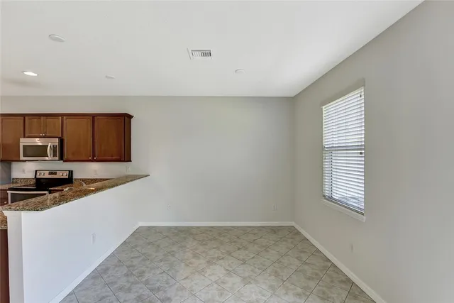 a kitchen with stainless steel appliances a sink a stove and a refrigerator