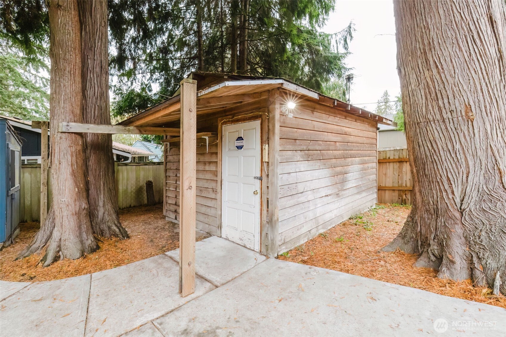 7600 Sandy Way Northeast Poulsbo, WA 98370 - Photo 34 of 40 a view of small house with backyard