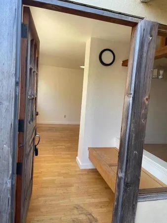 a kitchen with stainless steel appliances granite countertop a stove top oven a sink dishwasher and a refrigerator