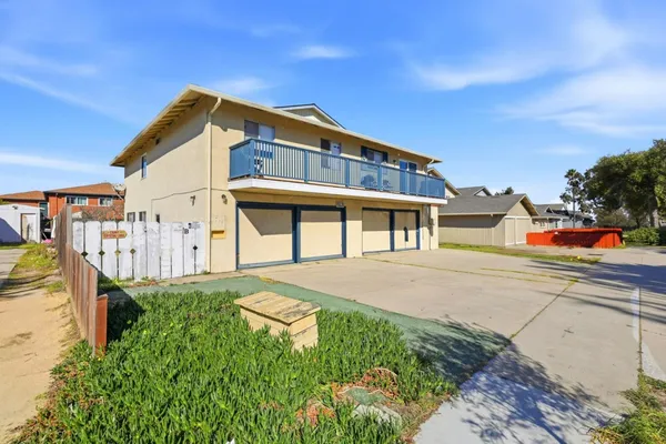 a front view of a house with a garage