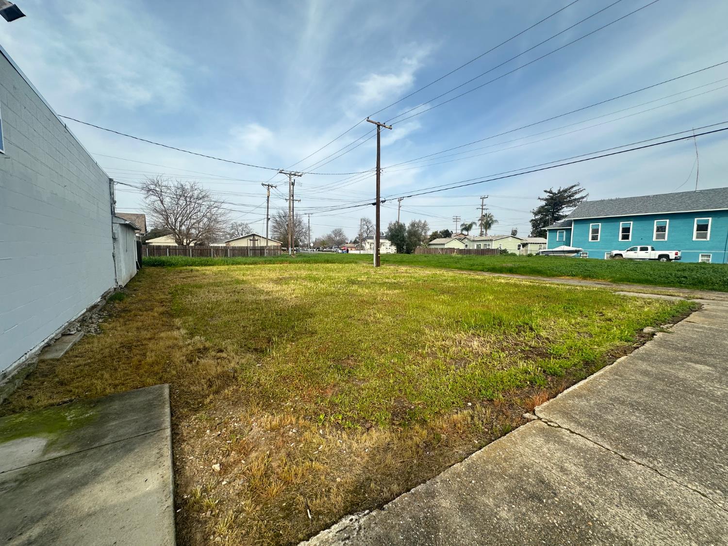a view of a living room with a floor to ceiling window and pool