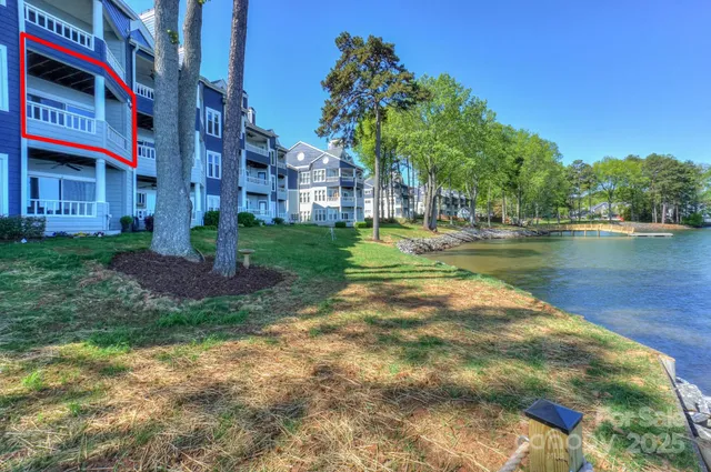 a view of a fountain in front of a brick house