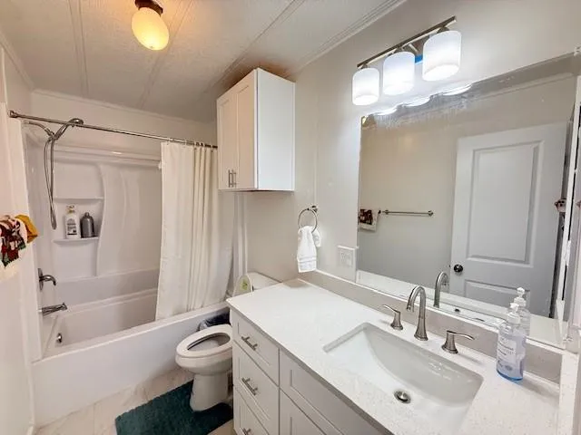 a large bed sitting in a bedroom next to a window