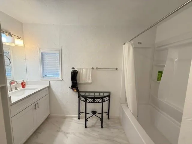 a bedroom with furniture and a potted plant