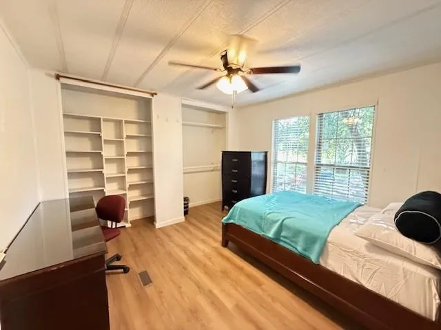 a kitchen with stainless steel appliances a white stove top oven and cabinets