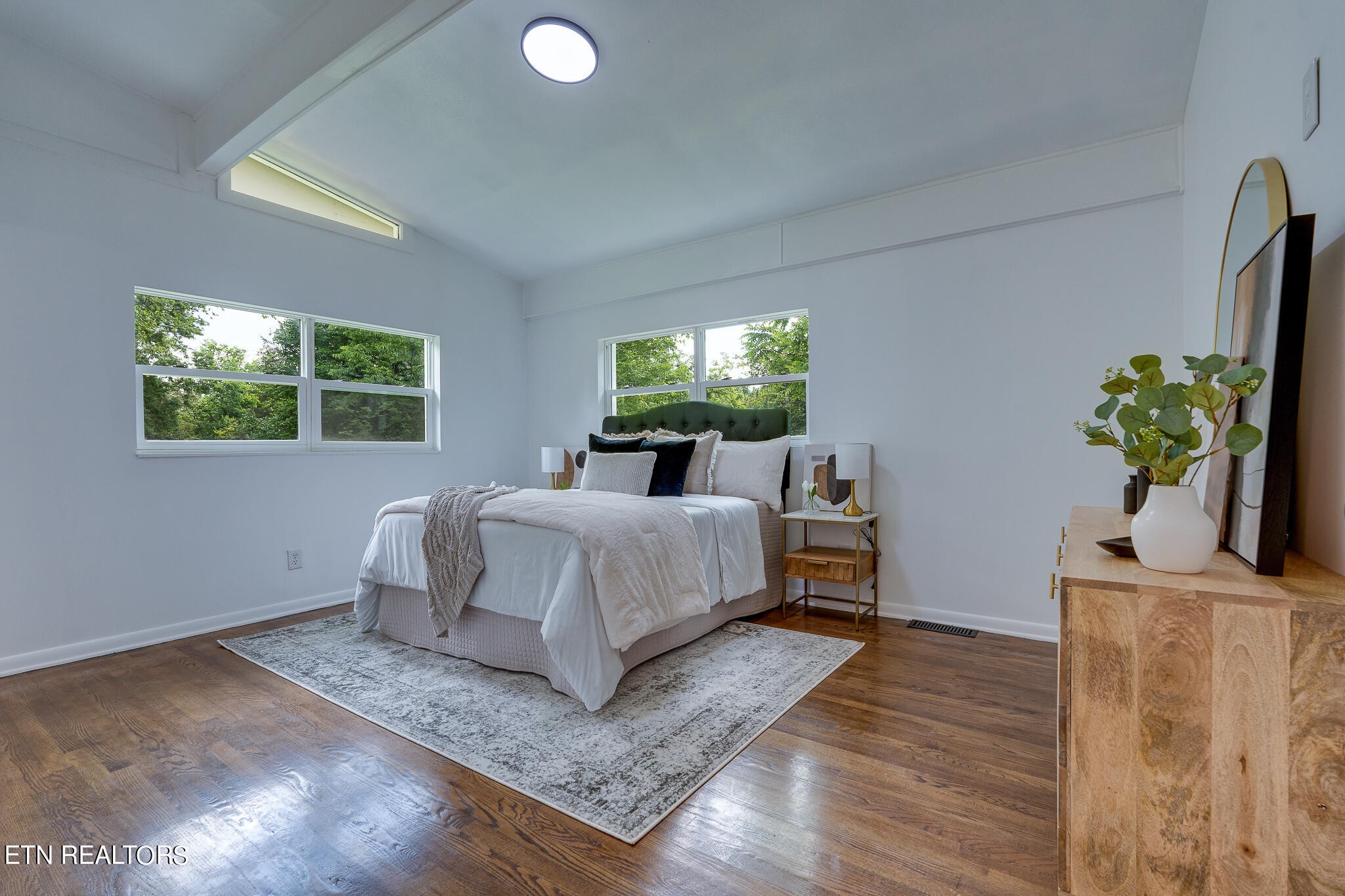 117 Columbia Drive Oak Ridge, TN 37830 - Photo 28 of 60 a bedroom with a bed table and a window