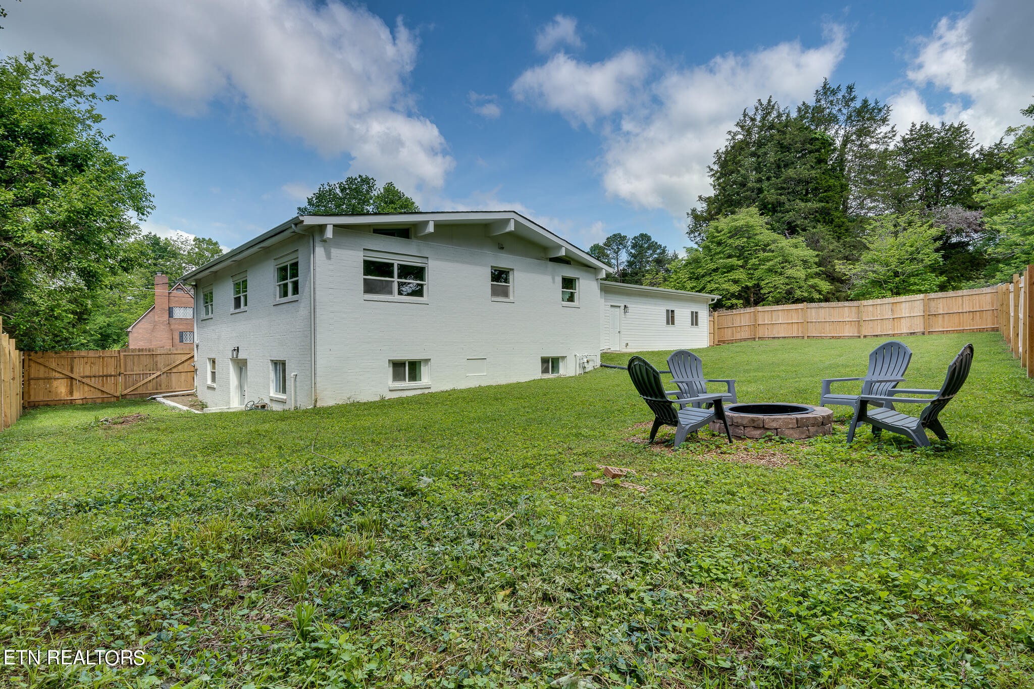 117 Columbia Drive Oak Ridge, TN 37830 - Photo 54 of 60 a view of backyard with outdoor seating and green space