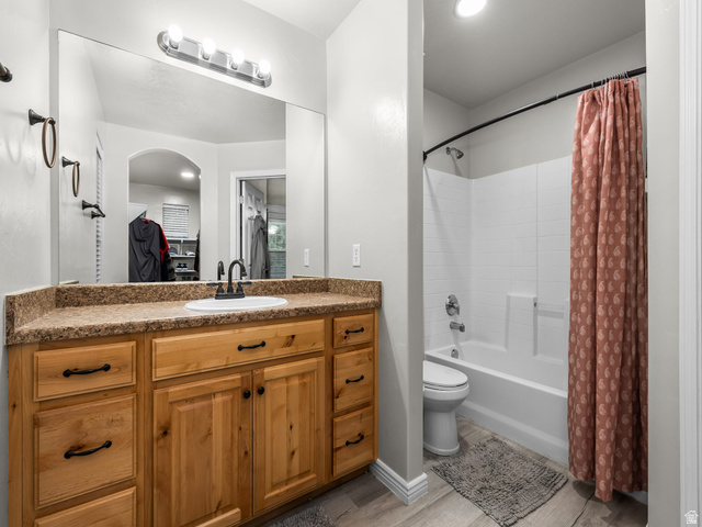 624 South 850 West Springville, UT 84663 - Photo 20 of 34 Wood-finish vanity with a single basin sink, counter space, and a large wall-mounted mirror