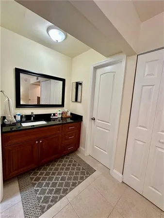 a room with mirror and furniture