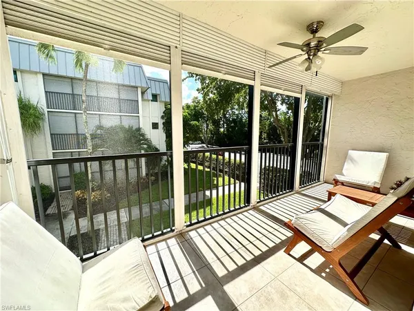 a view of a balcony with wooden floor