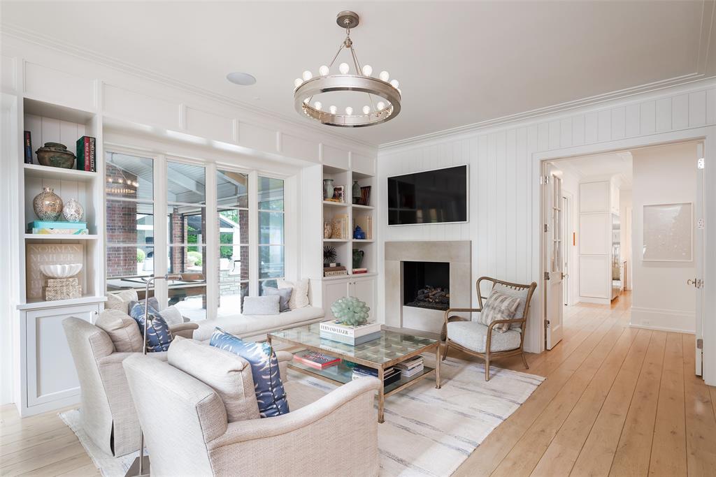 17 Robledo Drive Dallas, TX 75230 - Photo 17 of 40 a living room with fireplace furniture and a flat screen tv