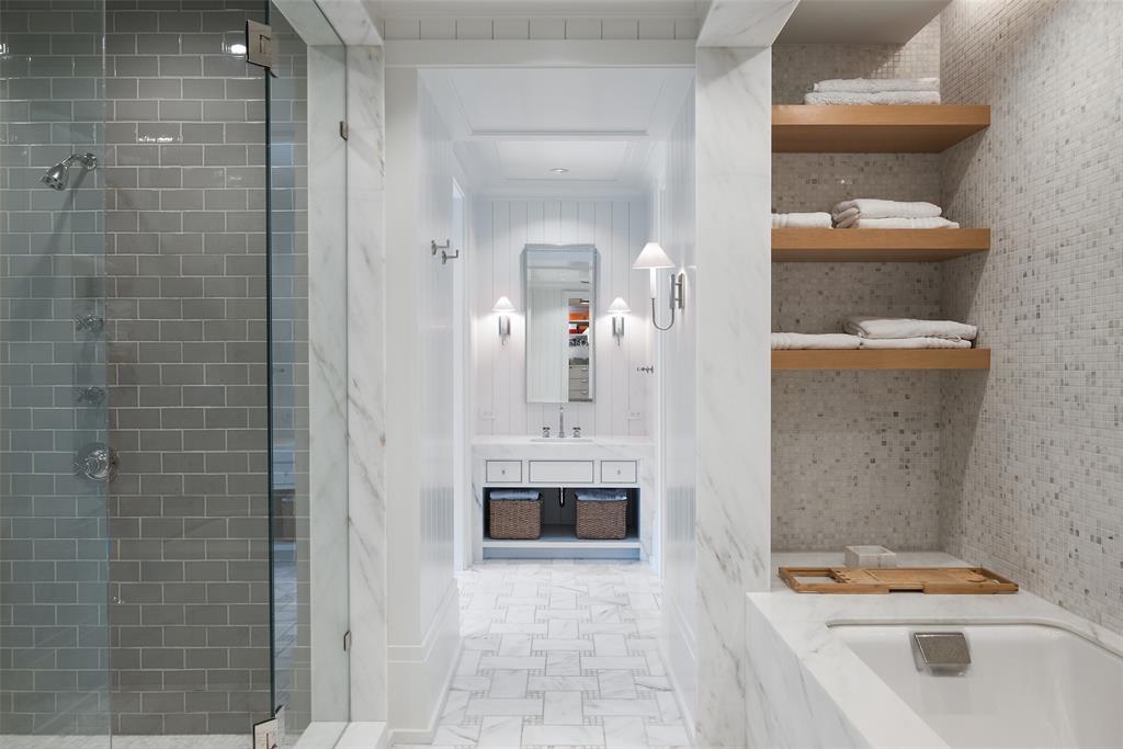 17 Robledo Drive Dallas, TX 75230 - Photo 20 of 40 a bathroom with a sink a toilet and shower