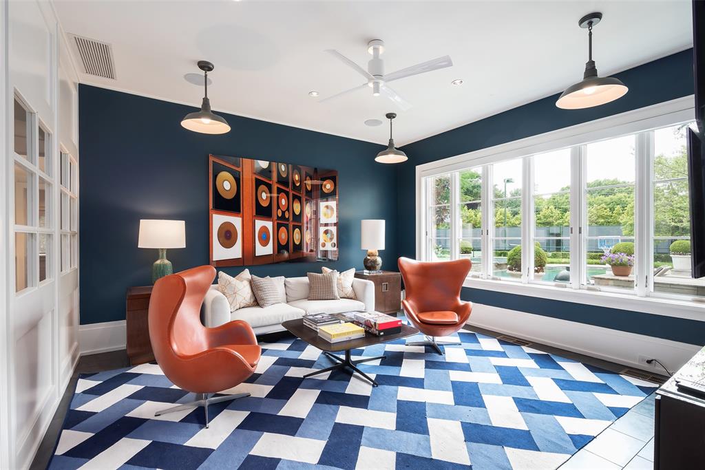 17 Robledo Drive Dallas, TX 75230 - Photo 23 of 40 a living room with a large window and dining table