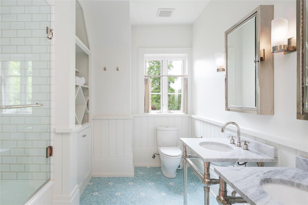 17 Robledo Drive Dallas, TX 75230 - Photo 25 of 40 a bathroom with a granite countertop sink and a mirror