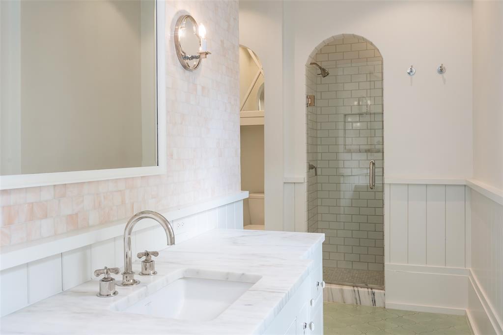17 Robledo Drive Dallas, TX 75230 - Photo 29 of 40 a bathroom with a sink and a mirror