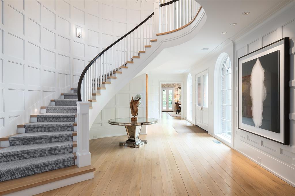 17 Robledo Drive Dallas, TX 75230 - Photo 5 of 40 a view of entryway and hall with wooden floor