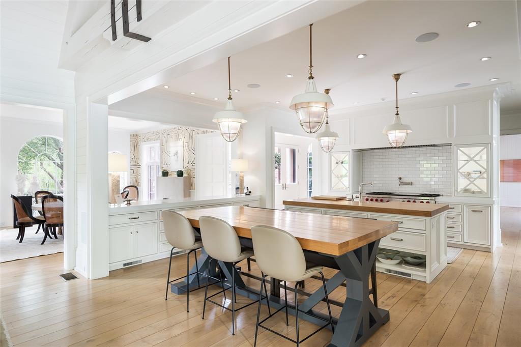 17 Robledo Drive Dallas, TX 75230 - Photo 8 of 40 a large kitchen with a table and chairs