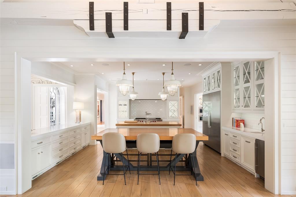 17 Robledo Drive Dallas, TX 75230 - Photo 9 of 40 a large kitchen with a table and chairs